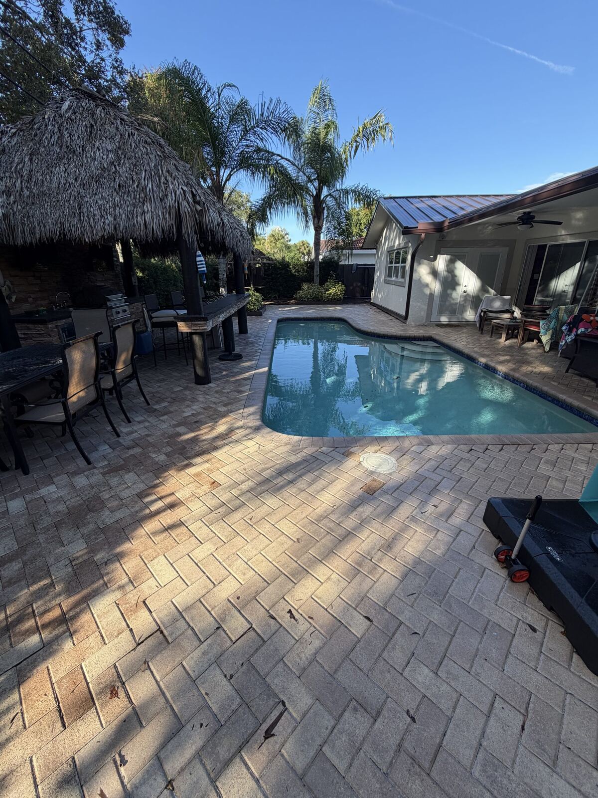 Aluminum pergola over paver patio